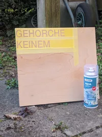 The stencil after spraying clear coat.